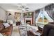 Cozy living room with fireplace, ceiling fan, stylish furnishings, and natural light at 2509 Cedarmill Dr, Franklin, IN 46131