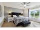 Elegant main bedroom featuring a plush bed, stylish decor, and a window offering a serene view at 2509 Cedarmill Dr, Franklin, IN 46131