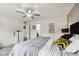 Serene main bedroom with a gray-toned palette, a comfortable bed, and soft, natural light streaming through the window at 2509 Cedarmill Dr, Franklin, IN 46131