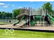 Community playground with multiple slides, climbing structures, and soft ground cover at 2509 Cedarmill Dr, Franklin, IN 46131