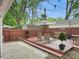 Cozy backyard with a wooden deck, seating area, and privacy fence, perfect for entertaining at 2612 E Northgate St, Indianapolis, IN 46220