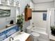Bathroom featuring a shower and tub combo, white subway tile, and double sink vanity at 2612 E Northgate St, Indianapolis, IN 46220