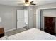 Neutral bedroom featuring soft carpet and view into closet areas at 2612 E Northgate St, Indianapolis, IN 46220