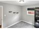 Bedroom featuring a large window, shelves, carpet, and neutral-toned walls at 2612 E Northgate St, Indianapolis, IN 46220
