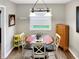 Bright dining area with a round table, white chairs, and a view to the outdoors at 2612 E Northgate St, Indianapolis, IN 46220