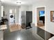 Modern kitchen with stainless steel appliances and an open layout leading to the living area at 2612 E Northgate St, Indianapolis, IN 46220
