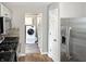 Open kitchen layout with stainless steel appliances and view into laundry area at 2612 E Northgate St, Indianapolis, IN 46220