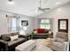 Bright living room featuring vaulted ceiling, neutral walls, comfortable seating, and modern décor at 2612 E Northgate St, Indianapolis, IN 46220