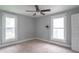 Neutral bedroom featuring neutral carpeting, overhead fan and fixture, and lots of natural lighting at 2823 Boulevard Pl, Indianapolis, IN 46208
