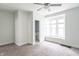 View of a bedroom featuring light walls, a ceiling fan, a large window, and carpeted floors at 2823 Boulevard Pl, Indianapolis, IN 46208