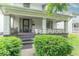 Charming home featuring a cozy front porch with classic features and manicured landscaping in a residential neighborhood at 2823 Boulevard Pl, Indianapolis, IN 46208