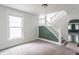 Inviting living room with staircase and fresh white trim with natural lighting at 2823 Boulevard Pl, Indianapolis, IN 46208