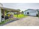Backyard featuring an outdoor patio area with comfortable seating and a detached garage, ideal for relaxation and storage at 2840 Denison St, Indianapolis, IN 46241