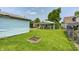 Backyard view showcasing a detached garage and a covered patio area, creating a versatile outdoor space at 2840 Denison St, Indianapolis, IN 46241