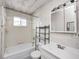 Cozy bathroom features tiled walls, tub and shower combination, and vanity at 2840 Denison St, Indianapolis, IN 46241