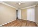 Bedroom with hardwood flooring, white trim and an open closet at 2840 Denison St, Indianapolis, IN 46241