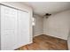 Bedroom with hardwood floors, white doors and a small window at 2840 Denison St, Indianapolis, IN 46241