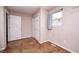 Bedroom with hardwood floors, white doors and a small window at 2840 Denison St, Indianapolis, IN 46241
