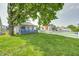 Charming single-story home with a well-maintained lawn and a cozy front porch, perfect for enjoying the outdoors at 2840 Denison St, Indianapolis, IN 46241