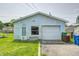 Detached garage with ample storage space and a convenient side entrance, adding functionality to the property at 2840 Denison St, Indianapolis, IN 46241