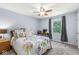 Inviting bedroom features soft light, a comfortable bed, a desk, and a large window with scenic views at 3030 E 236Th St, Cicero, IN 46034
