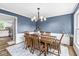 Charming dining room with traditional wood furniture, elegant chandelier, and inviting atmosphere at 3030 E 236Th St, Cicero, IN 46034