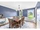 Formal dining room featuring a wooden table, and ample natural light, ideal for Gathering gatherings at 3030 E 236Th St, Cicero, IN 46034