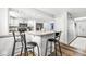 This open kitchen provides an island with seating, stainless appliances, and ample cabinet storage at 3030 E 236Th St, Cicero, IN 46034