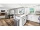 Open kitchen featuring stainless steel appliances, a granite countertop island, and an open view to living room at 3030 E 236Th St, Cicero, IN 46034