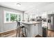 Bright kitchen featuring white cabinets, stainless steel appliances, and an island, perfect for cooking at 3030 E 236Th St, Cicero, IN 46034
