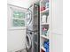 The laundry area includes a modern stackable washer and dryer and organized shelving at 3030 E 236Th St, Cicero, IN 46034