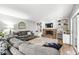 Cozy living room features a brick fireplace, built-in shelving, and comfortable seating at 3030 E 236Th St, Cicero, IN 46034