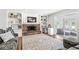 Bright living room featuring brick fireplace, built-in shelving, and sliding glass door access at 3030 E 236Th St, Cicero, IN 46034