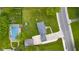 Aerial view of property showcasing layout, pool, detached garage, and surrounding landscape at 3113 Westenedge Dr, Columbus, IN 47203