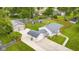 Aerial view of property featuring a well-maintained lawn, pool, detached garage, privacy fence, and a shed in the backyard at 3113 Westenedge Dr, Columbus, IN 47203