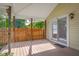 Open-air back porch with wood railing and sliding glass door, perfect for outdoor entertaining and enjoyment at 3113 Westenedge Dr, Columbus, IN 47203