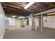 Large basement area with stairs, laundry and utilities at 3113 Westenedge Dr, Columbus, IN 47203