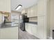 Kitchen with stainless steel appliances, gray counter top and modern cabinetry at 3113 Westenedge Dr, Columbus, IN 47203