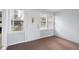 Inviting sunroom featuring a bright entry door and windows, perfect for relaxing and enjoying natural light at 3113 Westenedge Dr, Columbus, IN 47203