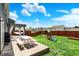 Backyard featuring a lush lawn, wooden pergola, picnic table, and playset at 3284 Clary Blvd South Dr, Greenwood, IN 46143