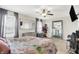 Bedroom with carpeted floors, ceiling fan, and window views to the neighborhood at 3284 Clary Blvd South Dr, Greenwood, IN 46143