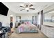 Bedroom featuring a floral bedspread, carpeted floors, ceiling fan, and mirrored side tables at 3284 Clary Blvd South Dr, Greenwood, IN 46143