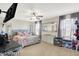 Bright bedroom featuring a floral bedspread, carpeted floors, and abundant natural light at 3284 Clary Blvd South Dr, Greenwood, IN 46143