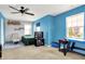 Bedroom featuring bright blue walls, carpeted floors, and two large windows for natural light at 3284 Clary Blvd South Dr, Greenwood, IN 46143
