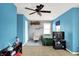 A colorful bedroom featuring bright blue walls, carpeted floors, and a large bed at 3284 Clary Blvd South Dr, Greenwood, IN 46143