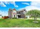 Beautifully landscaped yard featuring mature trees, lush greenery, and a charming two-story home exterior at 3284 Clary Blvd South Dr, Greenwood, IN 46143