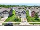 Charming two-story home with landscaped yard, black car in the driveway at 3284 Clary Blvd South Dr, Greenwood, IN 46143