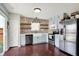 Well-equipped kitchen features a stone accent wall, stainless steel appliances, and plenty of cabinet space at 3284 Clary Blvd South Dr, Greenwood, IN 46143