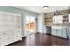 Bright kitchen featuring stone accent wall, modern appliances, and a walkout to the patio at 3284 Clary Blvd South Dr, Greenwood, IN 46143