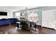 Spacious living room featuring a rustic wood table with bench seating and modern decor at 3284 Clary Blvd South Dr, Greenwood, IN 46143